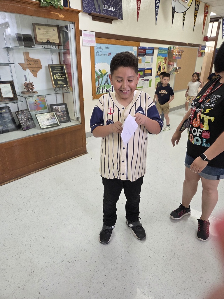 Attendance Challenge Student winner takes photo with prize 
