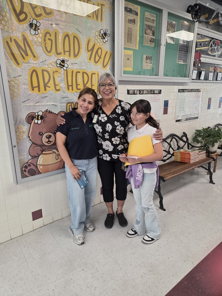 Attendance Challenge Student and staff winner takes photo with prize 