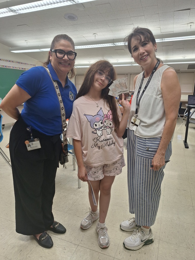 Attendance Challenge Student winner takes photo with prize and staff