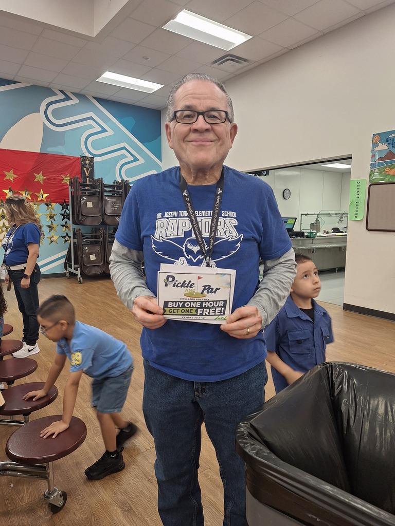 Attendance Challenge Staff winner takes photo with prize 