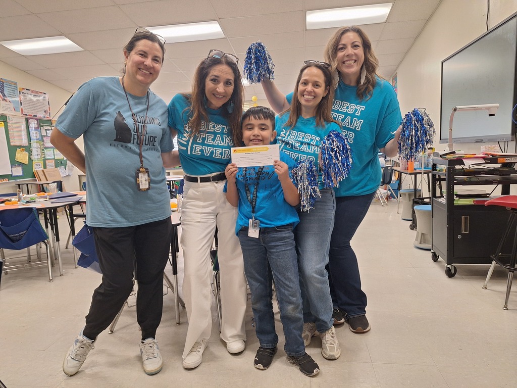 Attendance Challenge Student winner takes photo with prize and staff