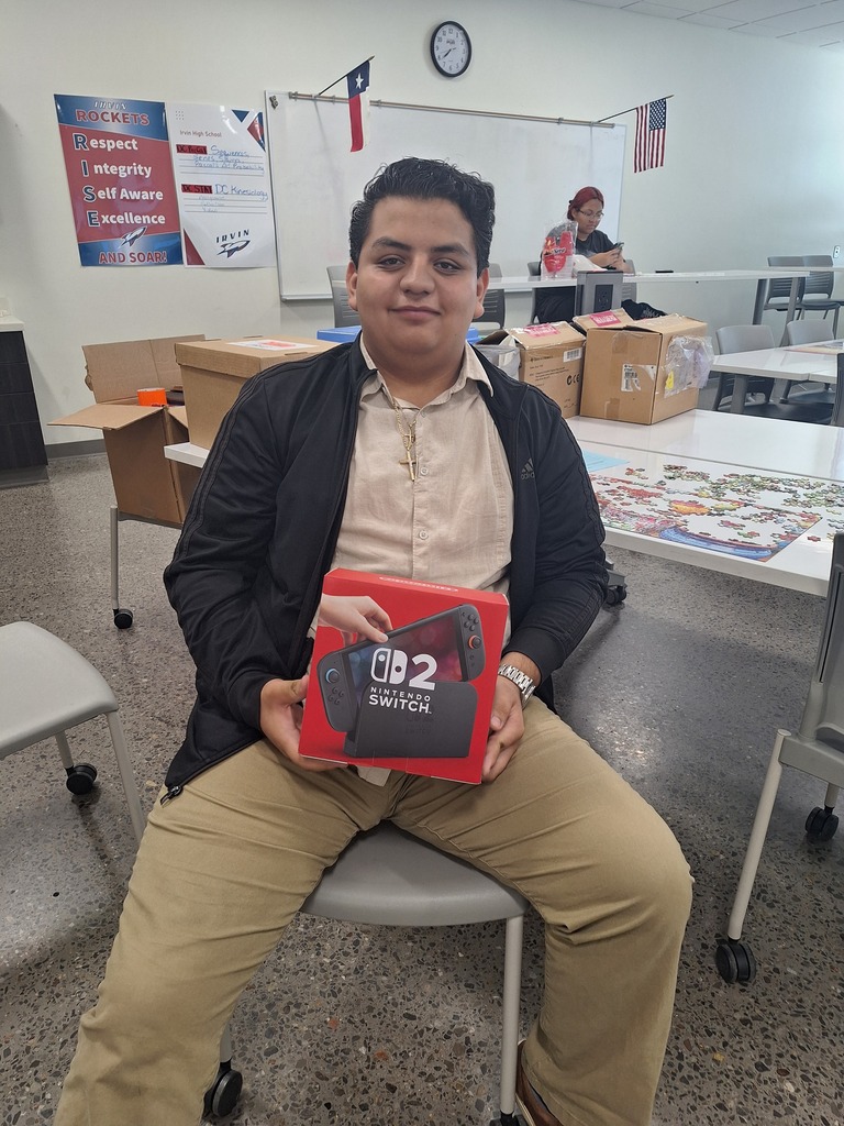 Attendance Challenge Student winner takes photo with prize 