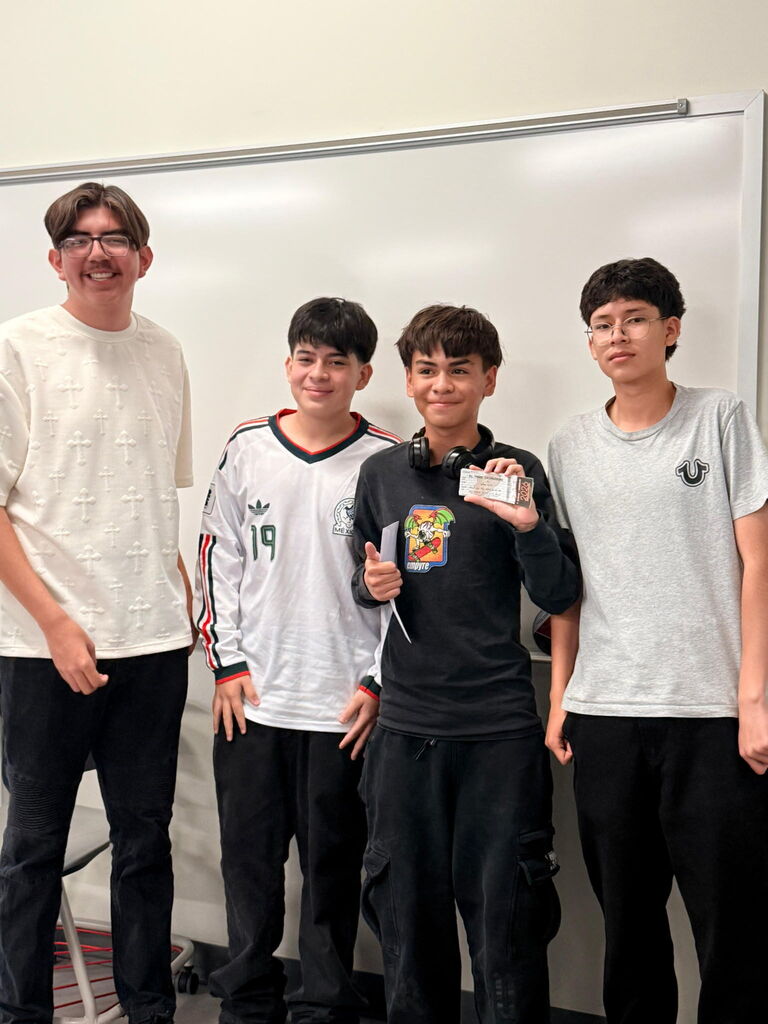 Attendance Challenge Student winner takes photo with prize and other students
