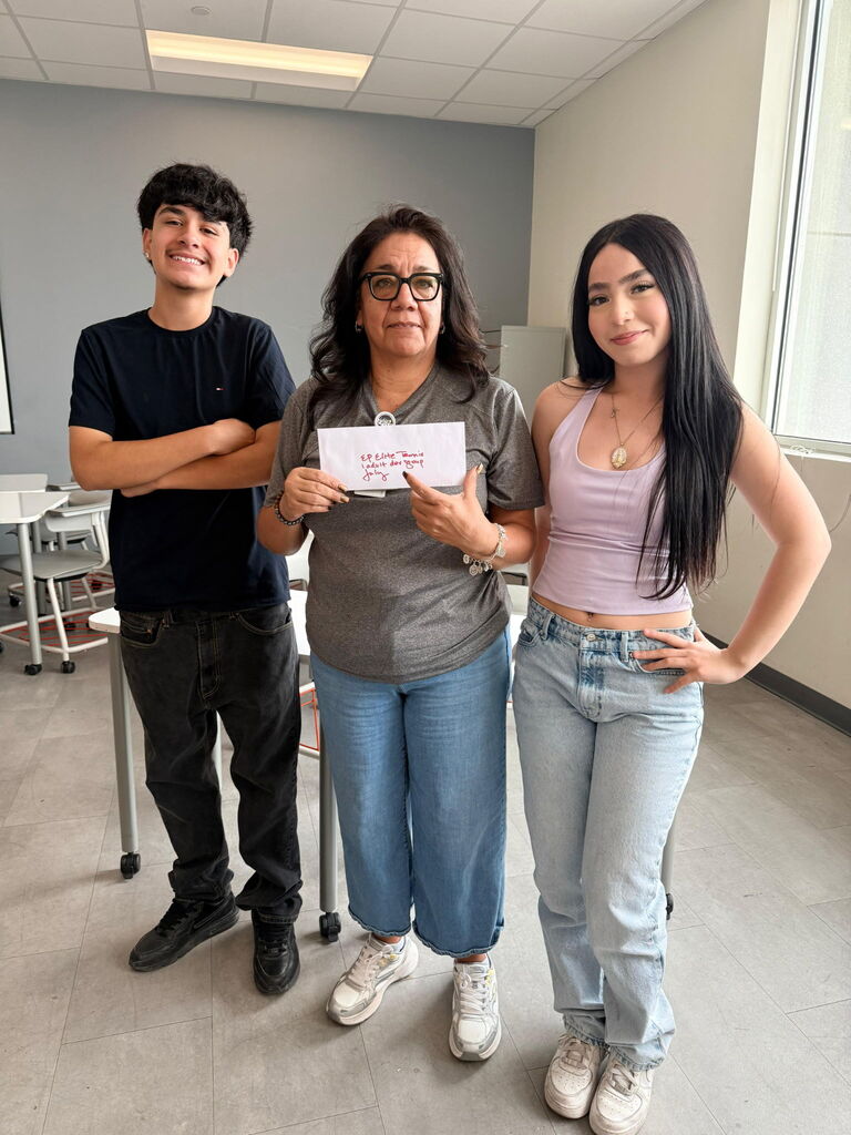 Attendance Challenge Stafft winner takes photo with prize