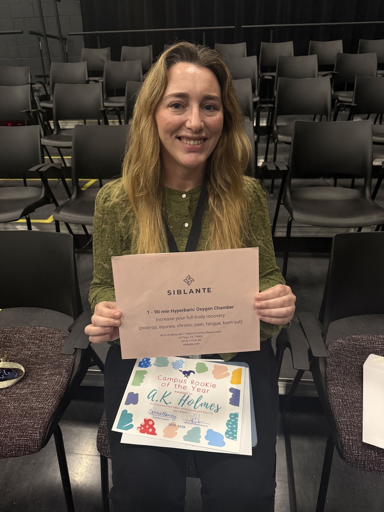 Attendance Challenge Staff winner takes photo with prize