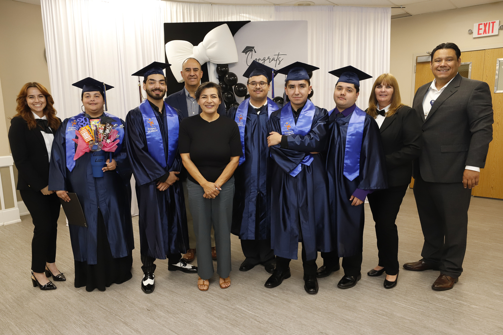 Project SEARCH graduates and El Paso ISD staff smile for a photo