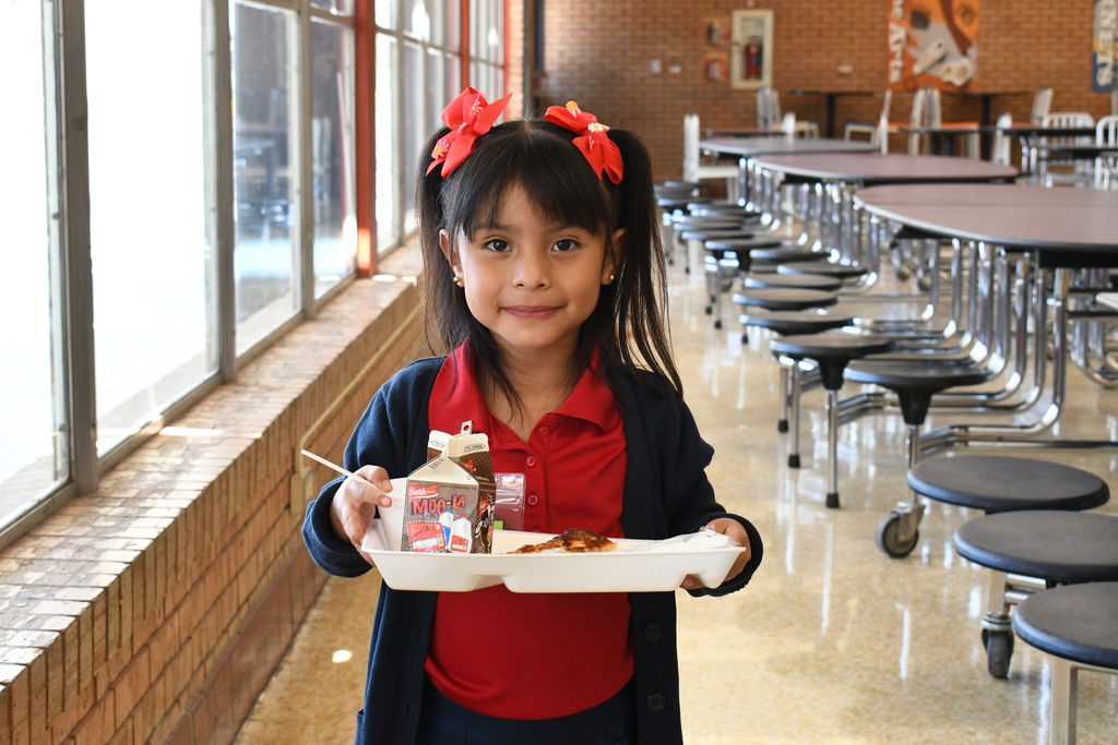 Student holding lunch tray