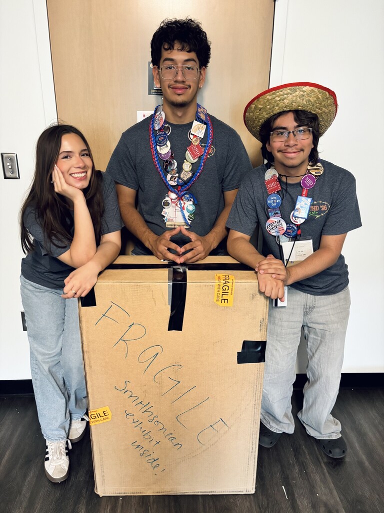 El Paso ISD students from Andress High School at the National History Day Nationals Competition posing in front of a large box that says fragile smithsonian exhibit inside!
