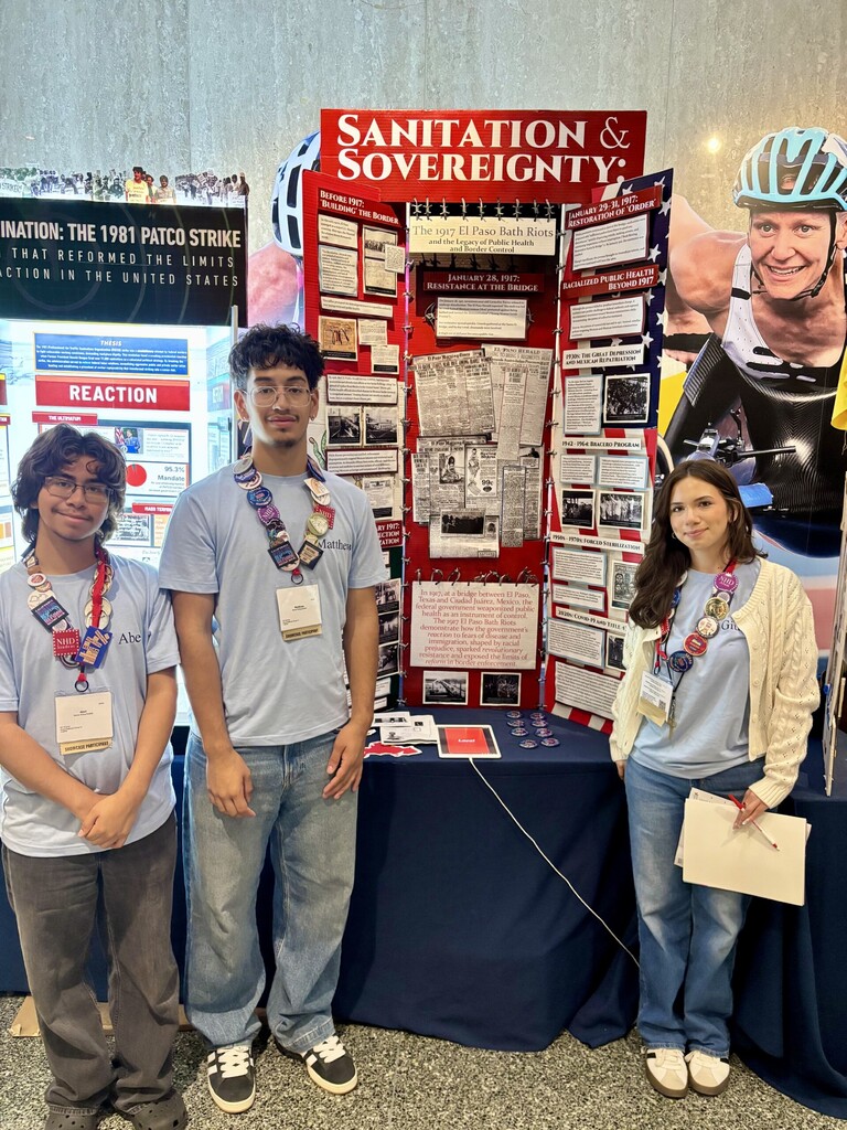 El Paso ISD students from Andress High School at the National History Day Nationals Competition in front of their project