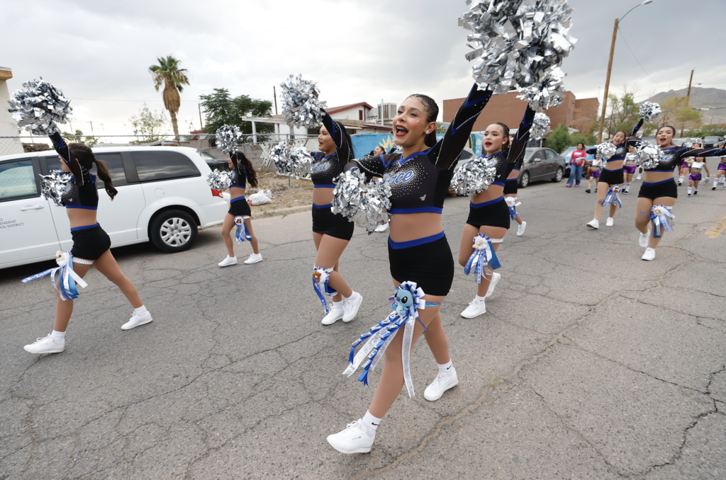 Bowie 2025 Homecoming Parade with photo of Bowie cheerleaders cheering