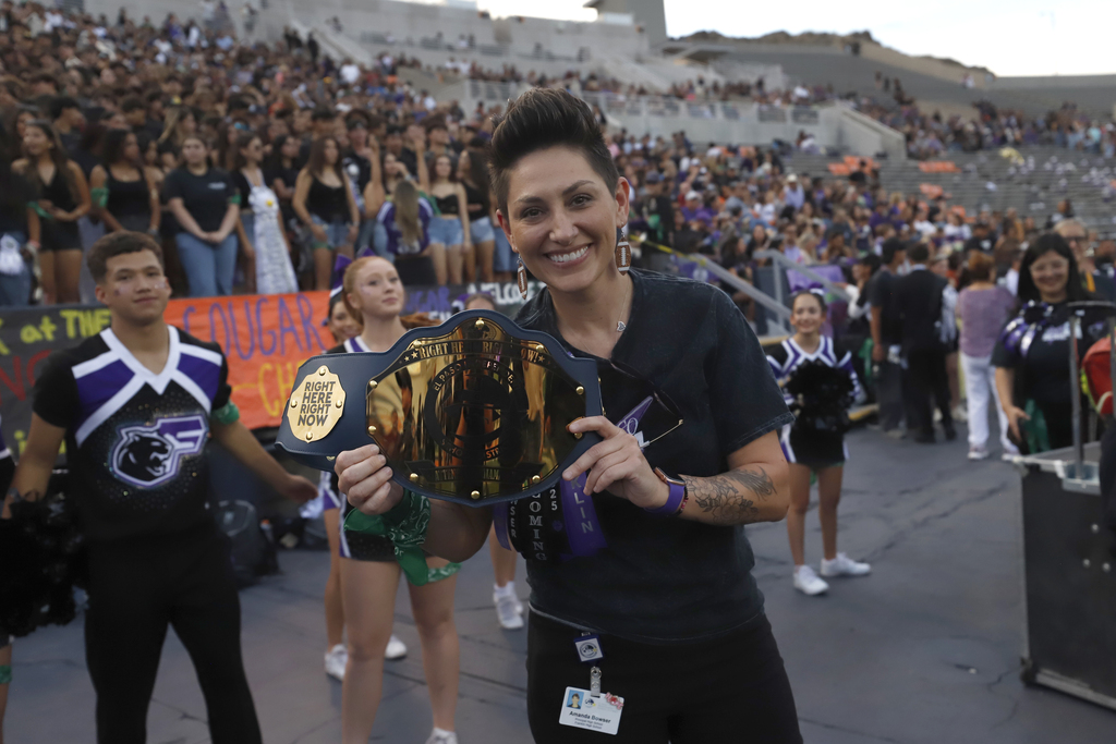 Franklin High School Principal holds attendance champion belt