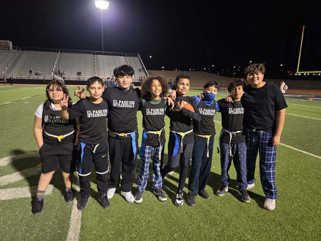 Murphree intramurals team smiles for a photo on football field
