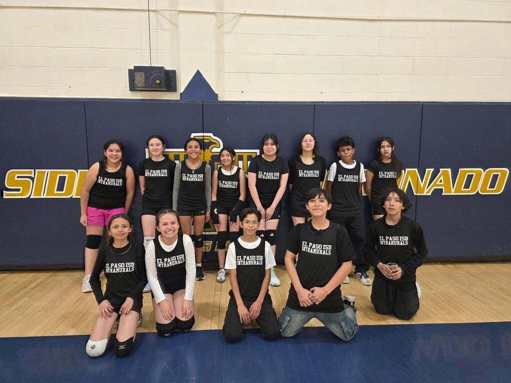 Murphree intramurals team smiles for a photo in basketball court