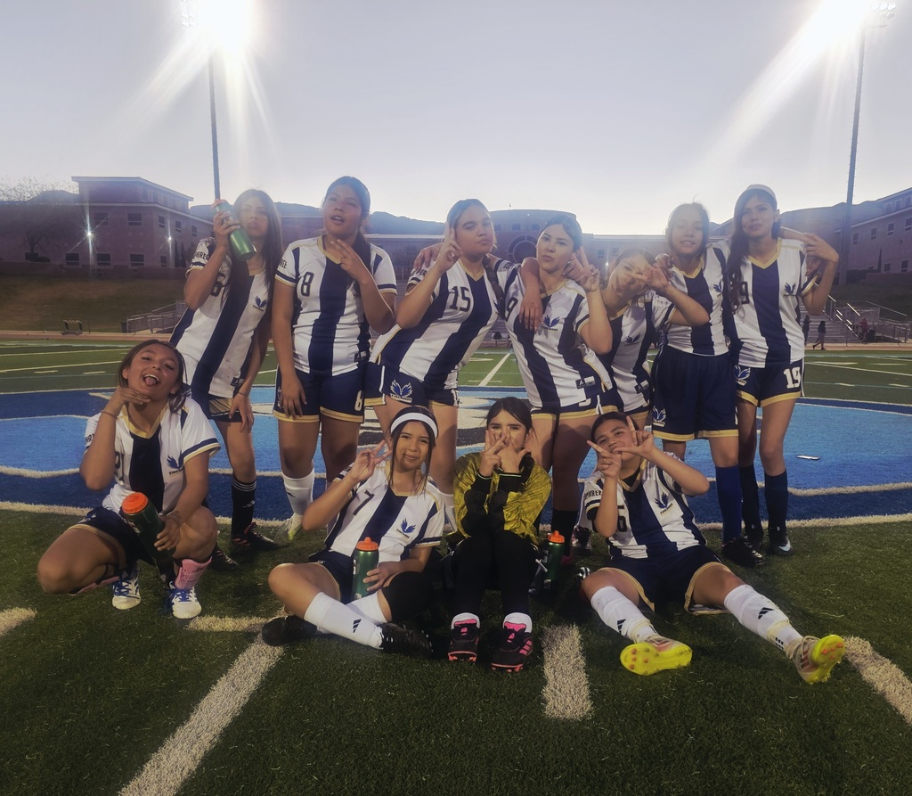 Murphree girls soccer team smiles for a group photo at Chapin High School football/soccer field