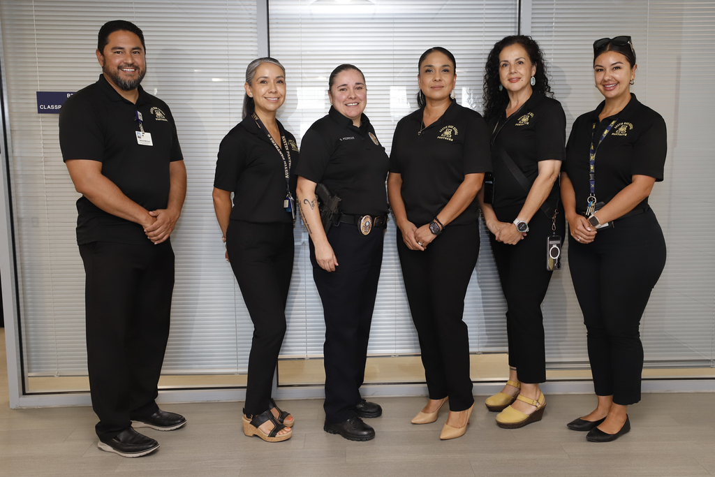 Austin staff takes group photo with Chief Pedregon
