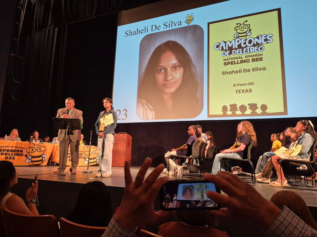 Shaheli De Silva from Young Women's STEAM Research and Preparatory Academy getting ready to spell on stage