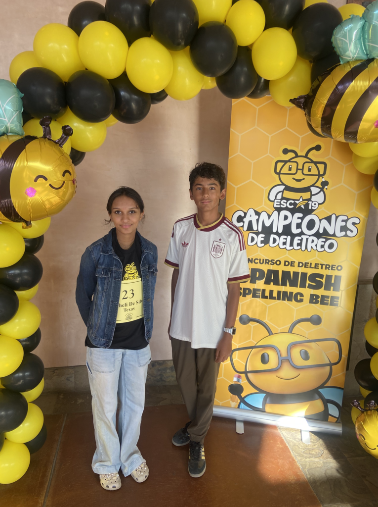 Photo of Ferrán Martínez Caloca from Wiggs Middle School and Shaheli De Silva from Young Women's STEAM Research and Preparatory Academy smiling for a photo together at the National Spanish Spelling Bee