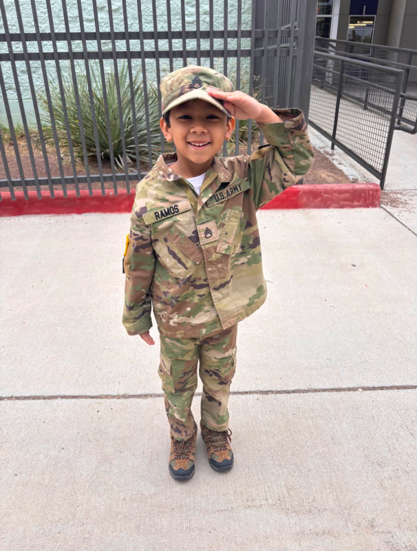 Photo of Murphree PK-8 student in military attire saluting