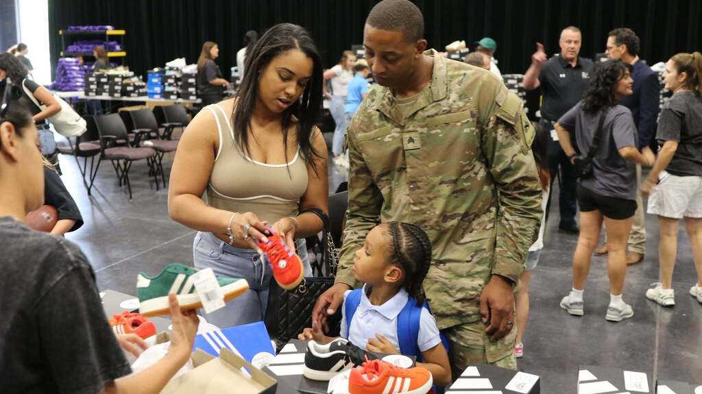 Military family picks new shoes for their child