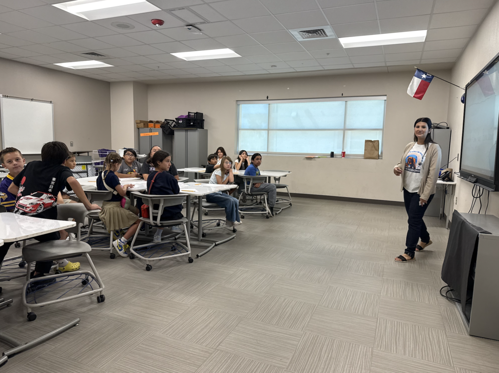 Haskins PK-8 students listening to a teacher in classroom