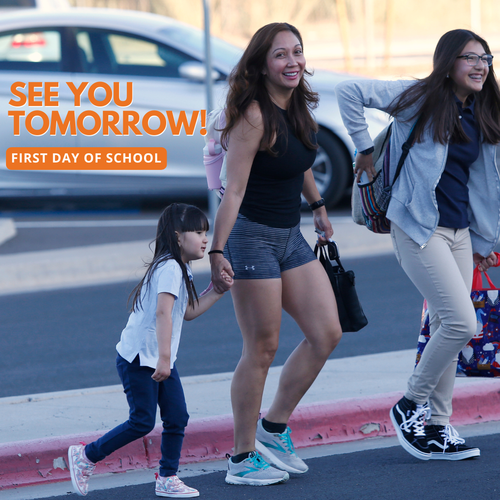 Photo of parent walking her children to school smiling with text that says See you tomorrow! First day of school
