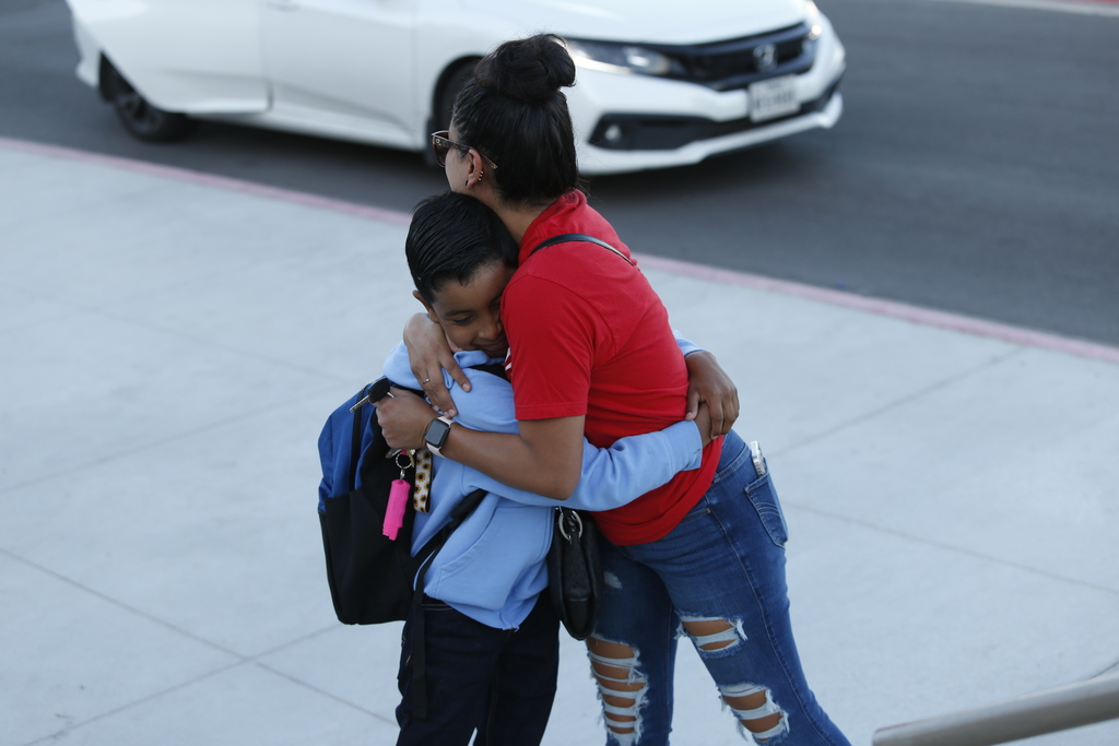 Photo of student hugging mom
