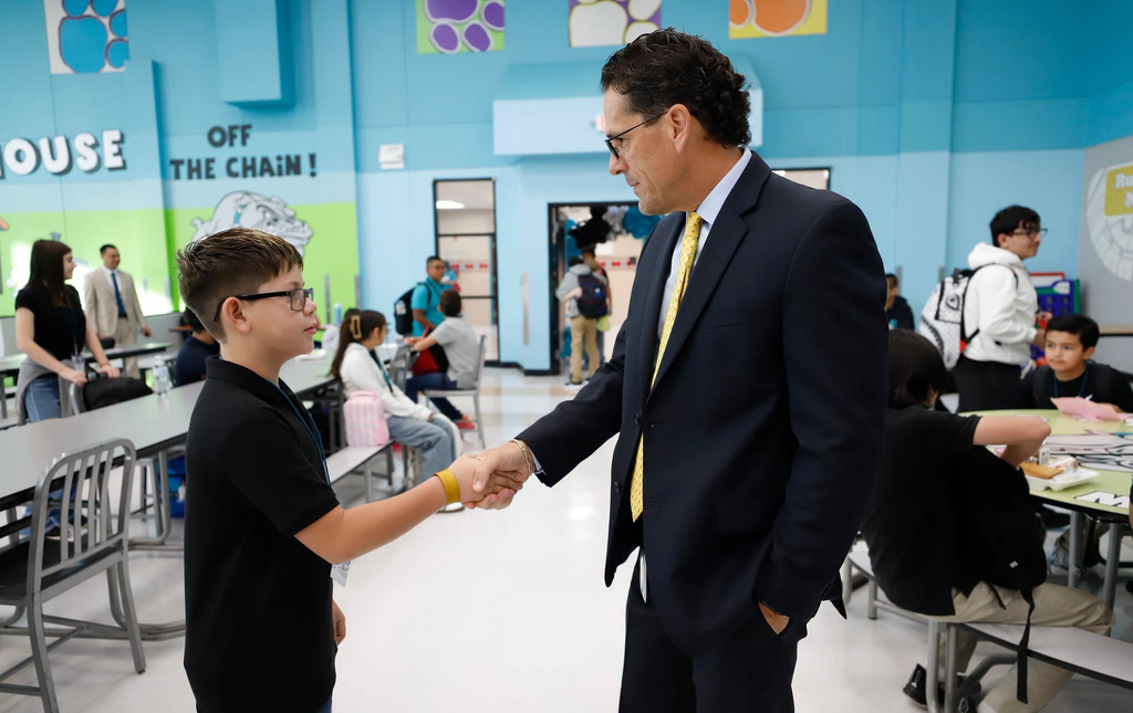 Superintendent Dr. Lusk shakes Brown Middle School students hand