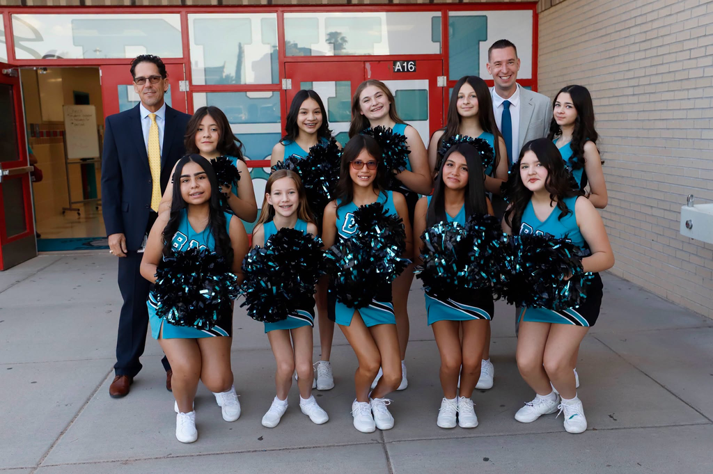 Brown Middle School cheerleaders, principal, and Superintendent Dr. Lusk take a group photo