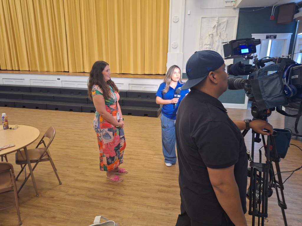 Media covering Crockett Elementary Fine Arts Academy on the first day of school