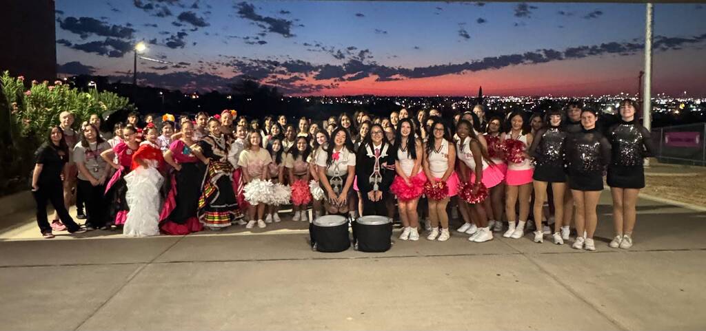 YWA Drumline, and Cheer are posing towards the camera.