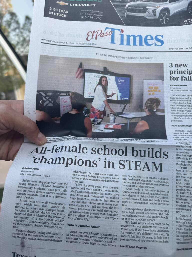 Newspaper picture with a headline saying "All-female school builds "champions" in STEAM. A short article is shown about the new school principal.