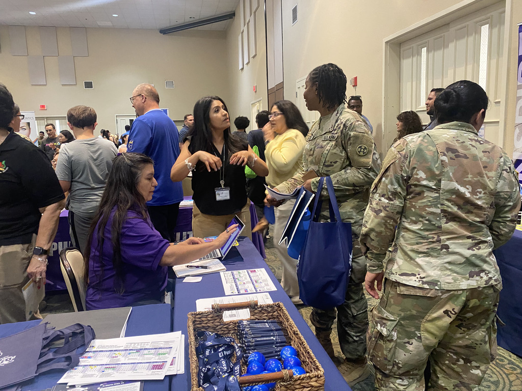 El Paso ISD staff members talking to military families at the 2026 Bienvenidos a Bliss Relocation Fair
