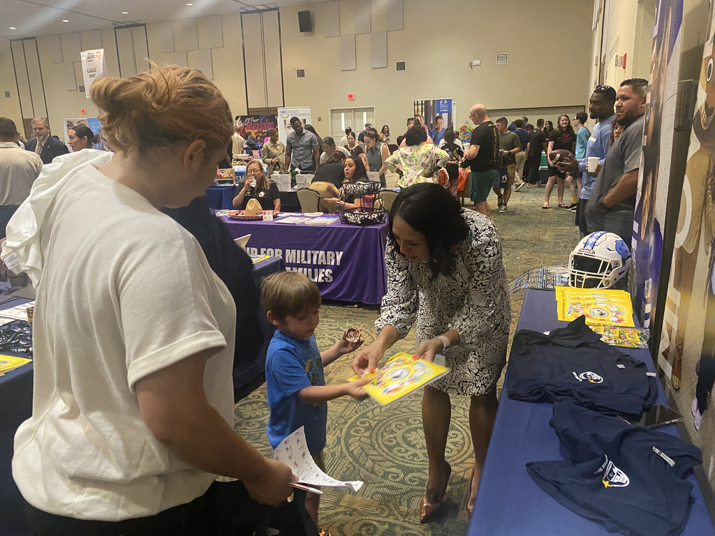 El Paso ISD staff members talking to military families at the 2026 Bienvenidos a Bliss Relocation Fair