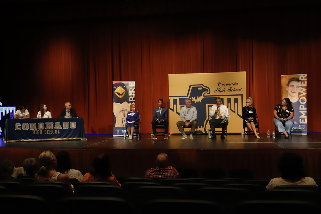  Photo of District 7 Candidate Forum with candidates on stage and crowd watching