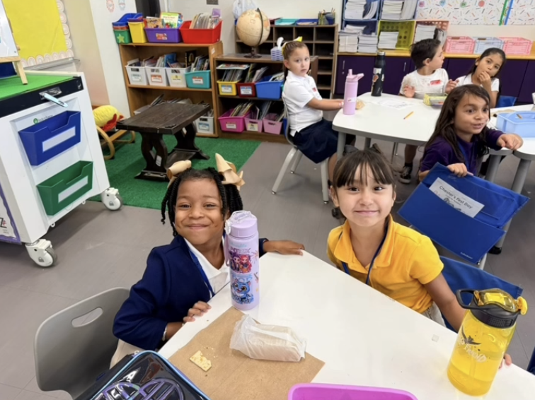 Hartley students smile for a photo during class