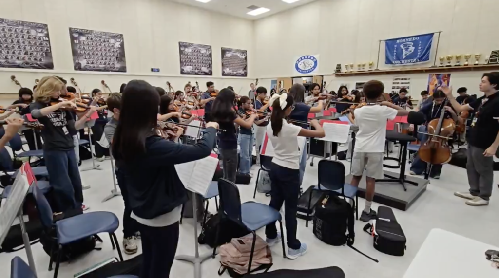 Hornedo Middle School Orchestra playing during class