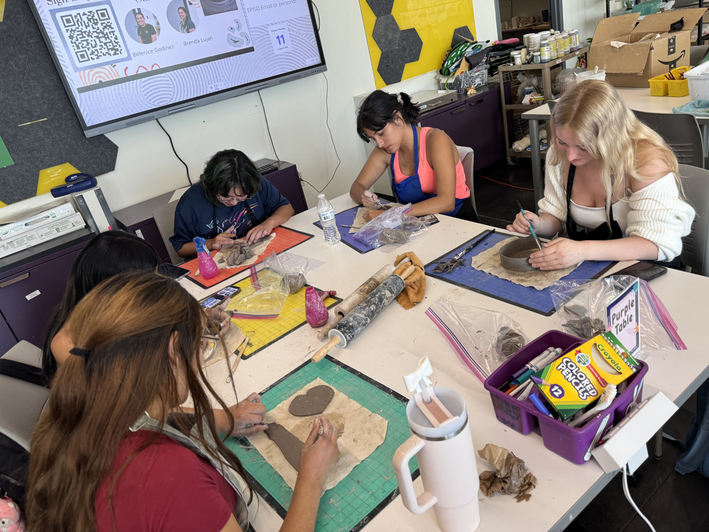 El Paso ISD employees working on pottery together