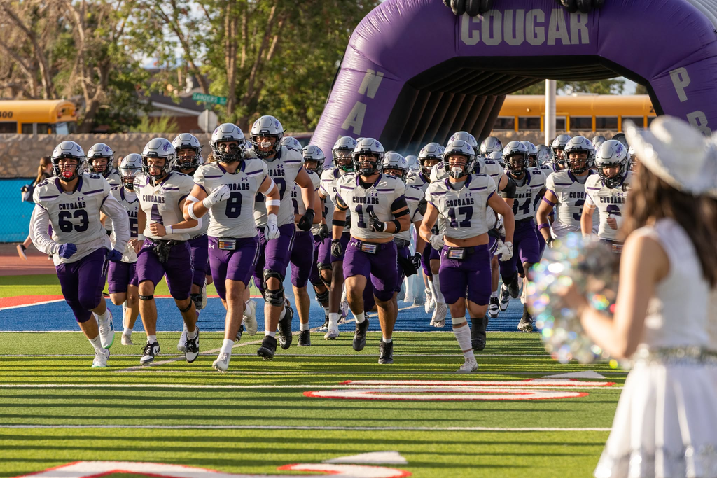 Franklin High School football running onto the field to start game