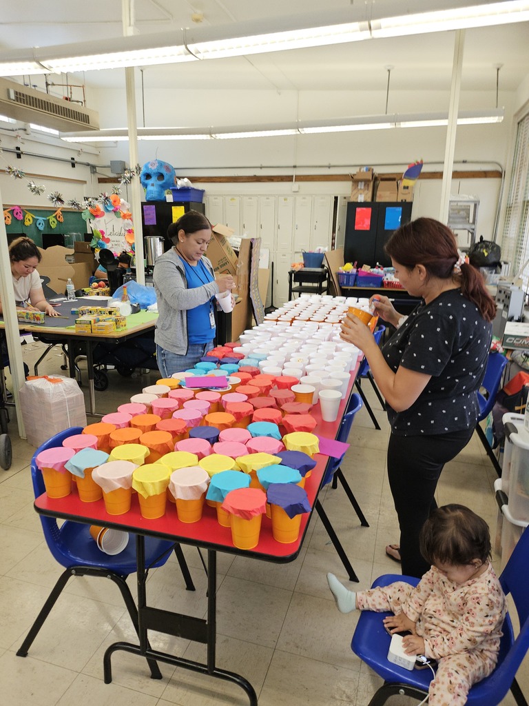 Volunteers help set up colorful cups