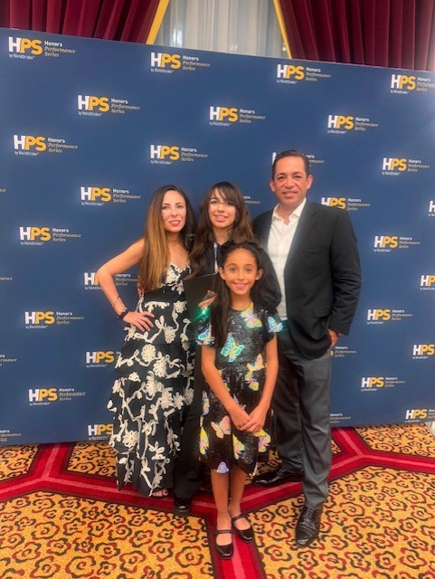 Vivian Lopez smiles for a photo with her family