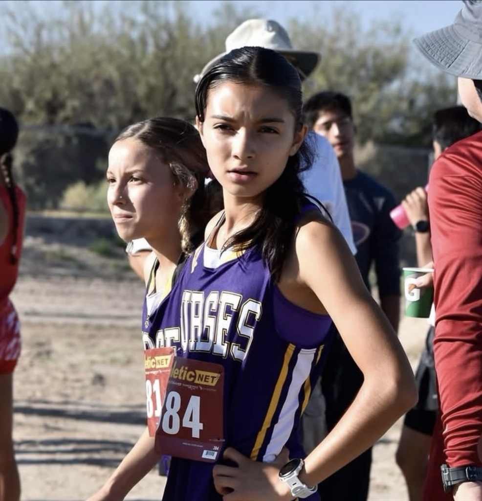 Photo of Burges High School cross country athlete Sayuri Ulloa looking at camera