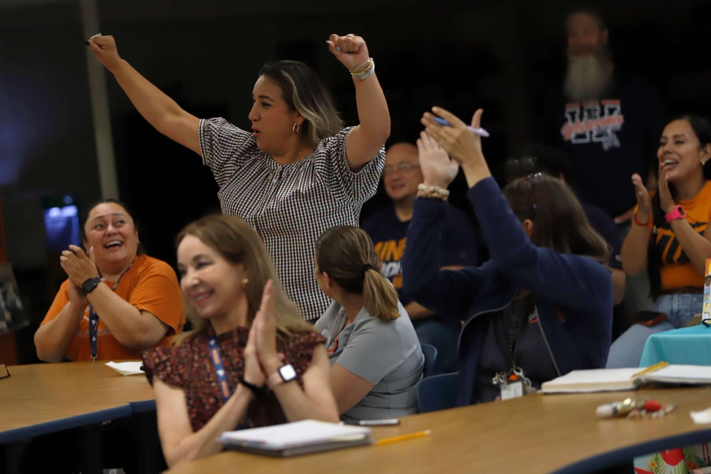 Wiggs Middle School staff clapping and cheering