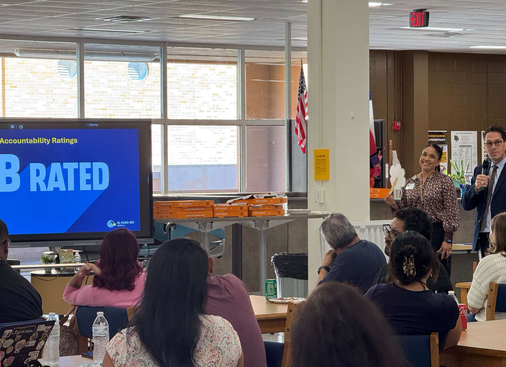 Austin staff meeting staff listening to Principal Ruiz and Superintendent Dr. Lusk as they congratulate the campus on receiving a B rating