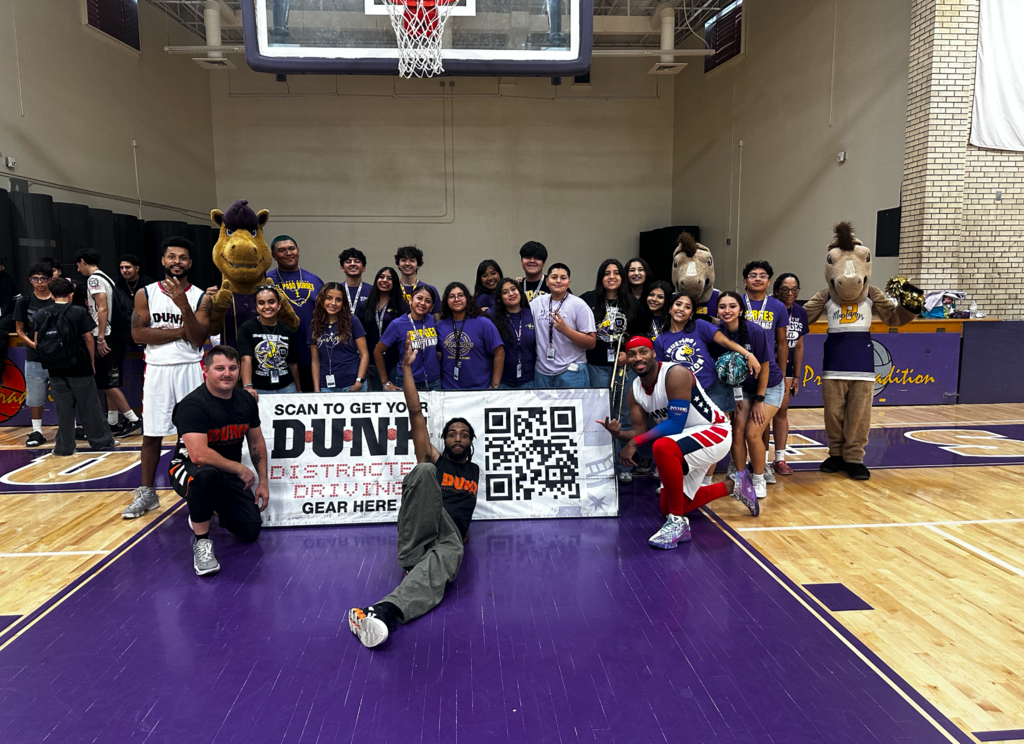 Burges students take photo with the U.S. Army and Adrenaline Games Alliance (AGA Nation) at the Slam Dunk Rally