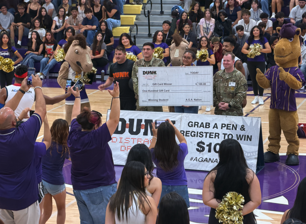U.S. Army and Adrenaline Games Alliance (AGA Nation) gives a Burges student a check for $100