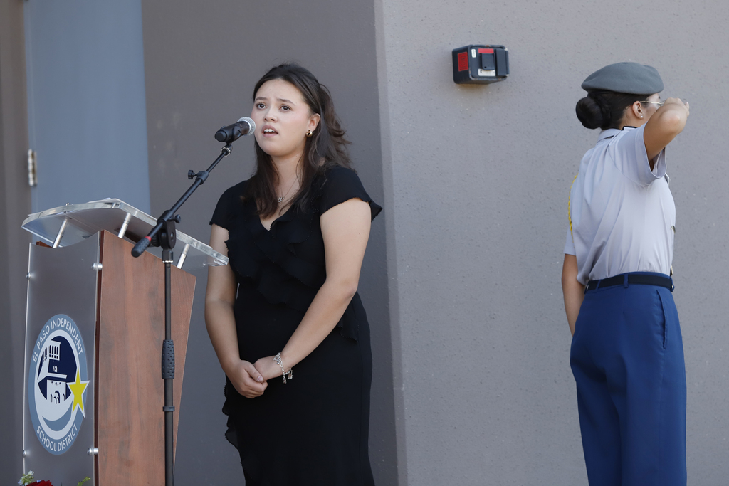 Burges High School student singing national anthem