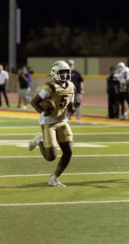 Photo of Jamari Milton running during game with ball