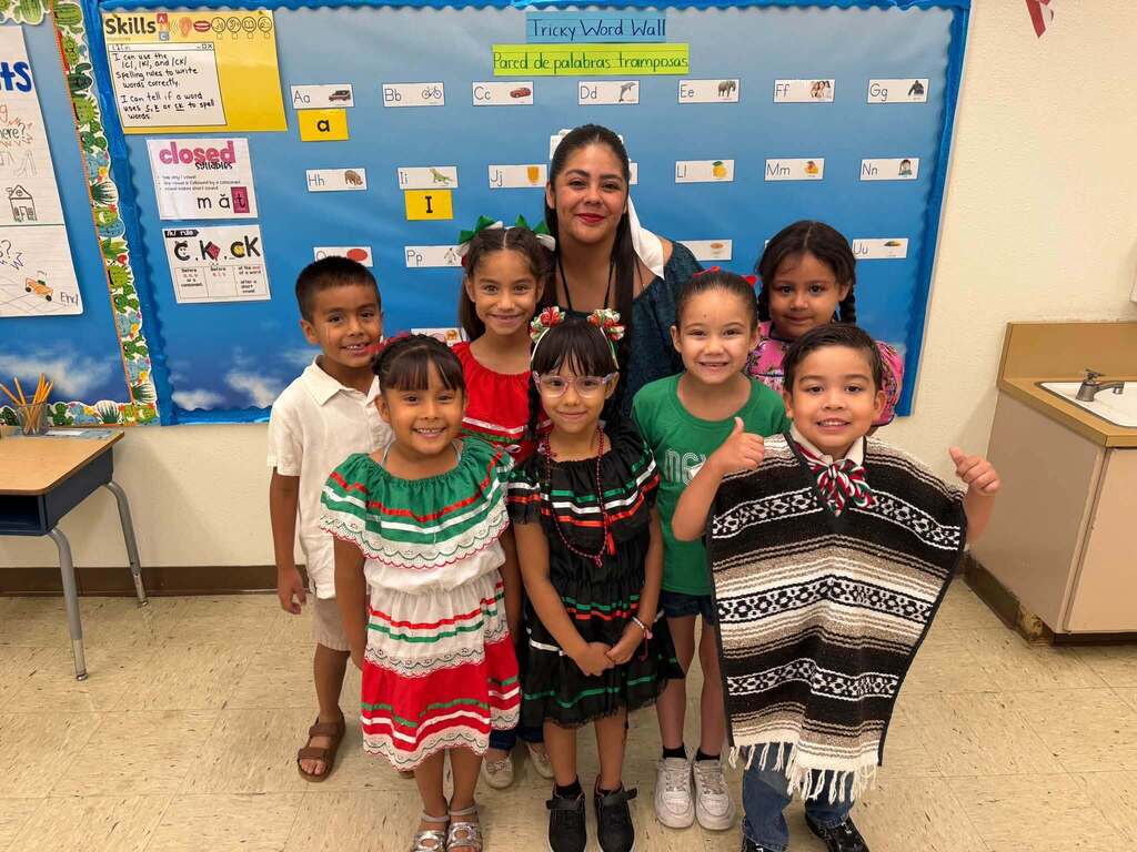 El Paso ISD students and staff member take a photo dress in Mexican Independence Day attire