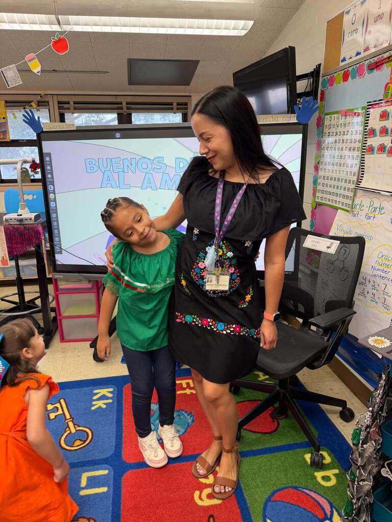 Sunrise Elementary School student and staff member take a photo dress in Mexican Independence Day attire