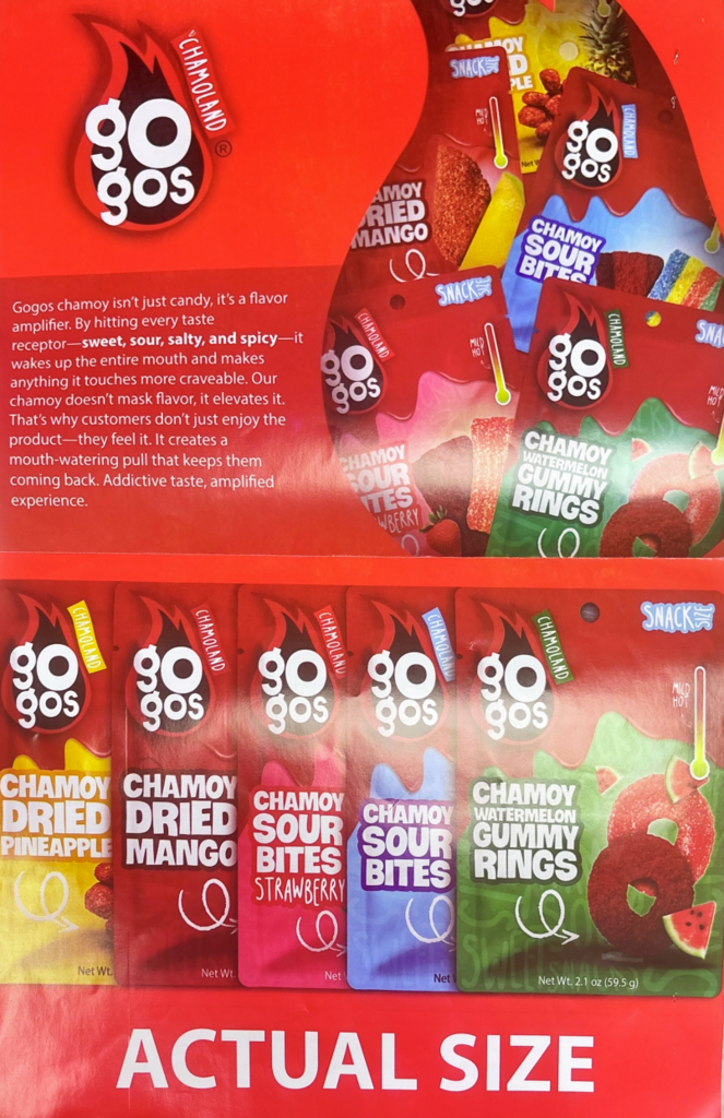 A display shows six packs of 90gos candy with various fruit flavors, including strawberry, mango, and pineapple.